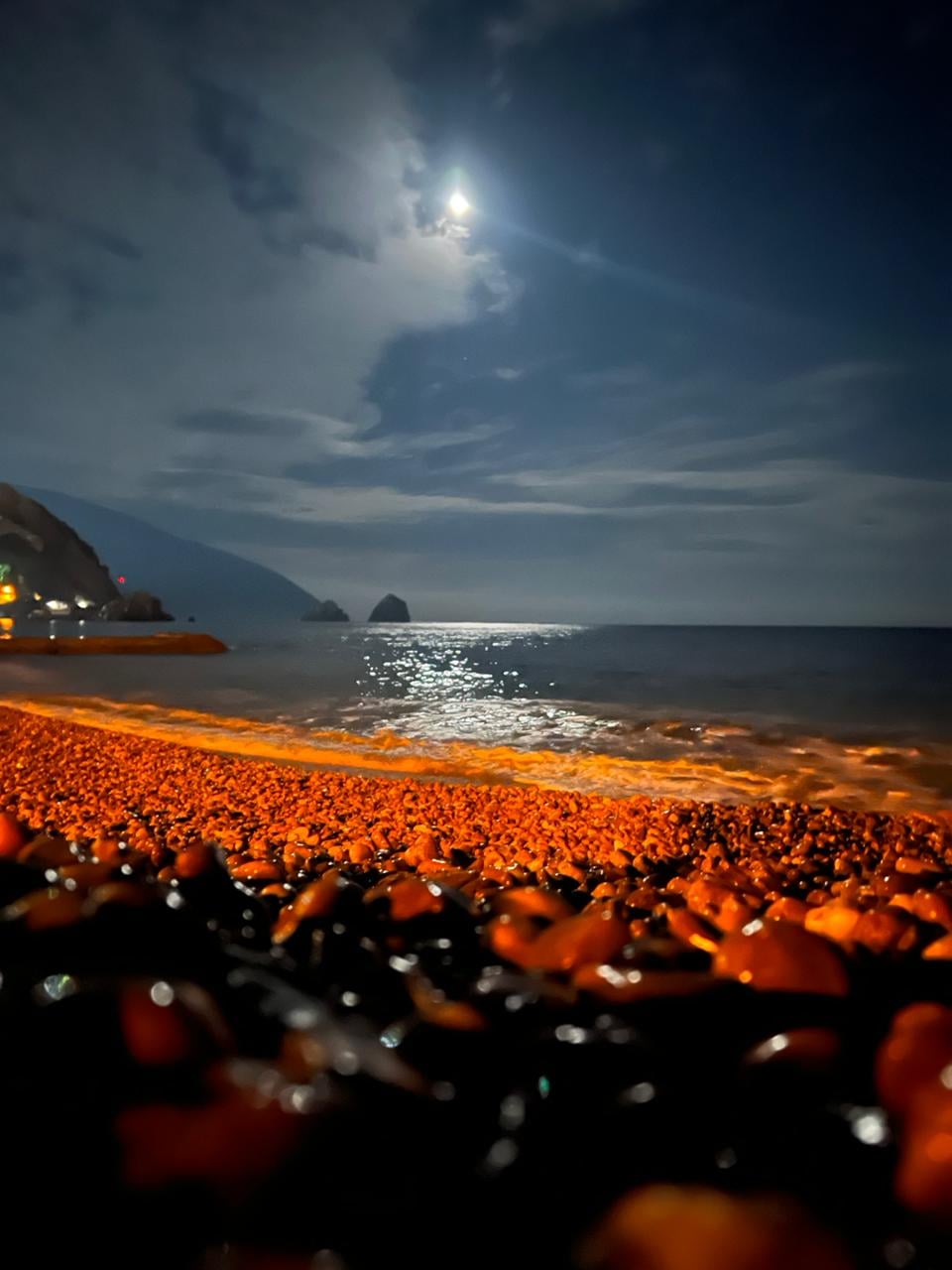 Moonlight on rocky beach