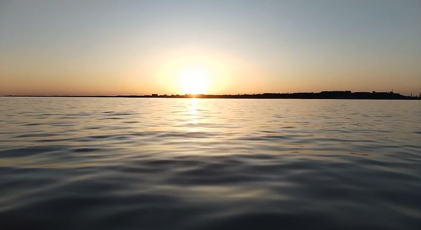 Sunset at sea. Sunset over the sea with the sun's reflection on the water.