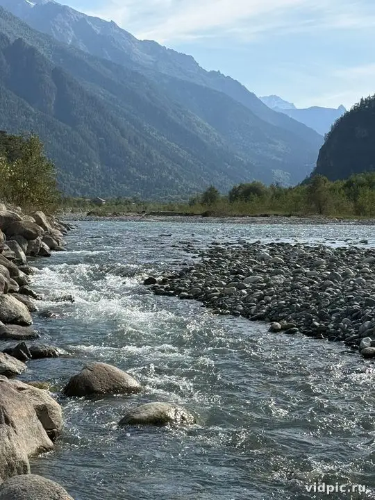 A mountain river with fast-flowing water among stones. Perfect for illustrating wilderness and travel.